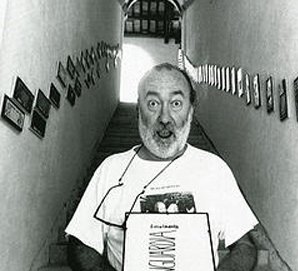 A black and white portrait of Sarenco in a stairwell.