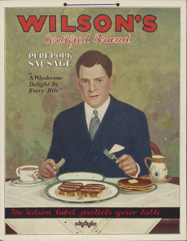 Color advertisement. "Wilson's Certified Brand" in red lettering at the top. Text reads "Pure Pork Sausage. 'A Wholesome Delight in Every Bite,' The Wilson label protects your table." Hand-colored photograph of a young Edward Foss Wilson seated at a table holding a knife and fork. In front of him on a white table cloth are plates with sausages and pancakes, a coffee cup, and a pitcher. Edward is a white man with dark hair wearing a dark blue suite and tie.