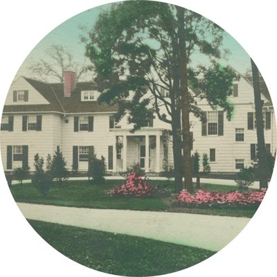 Color postcard of Edellyn Farm house cropped into a circle shape.